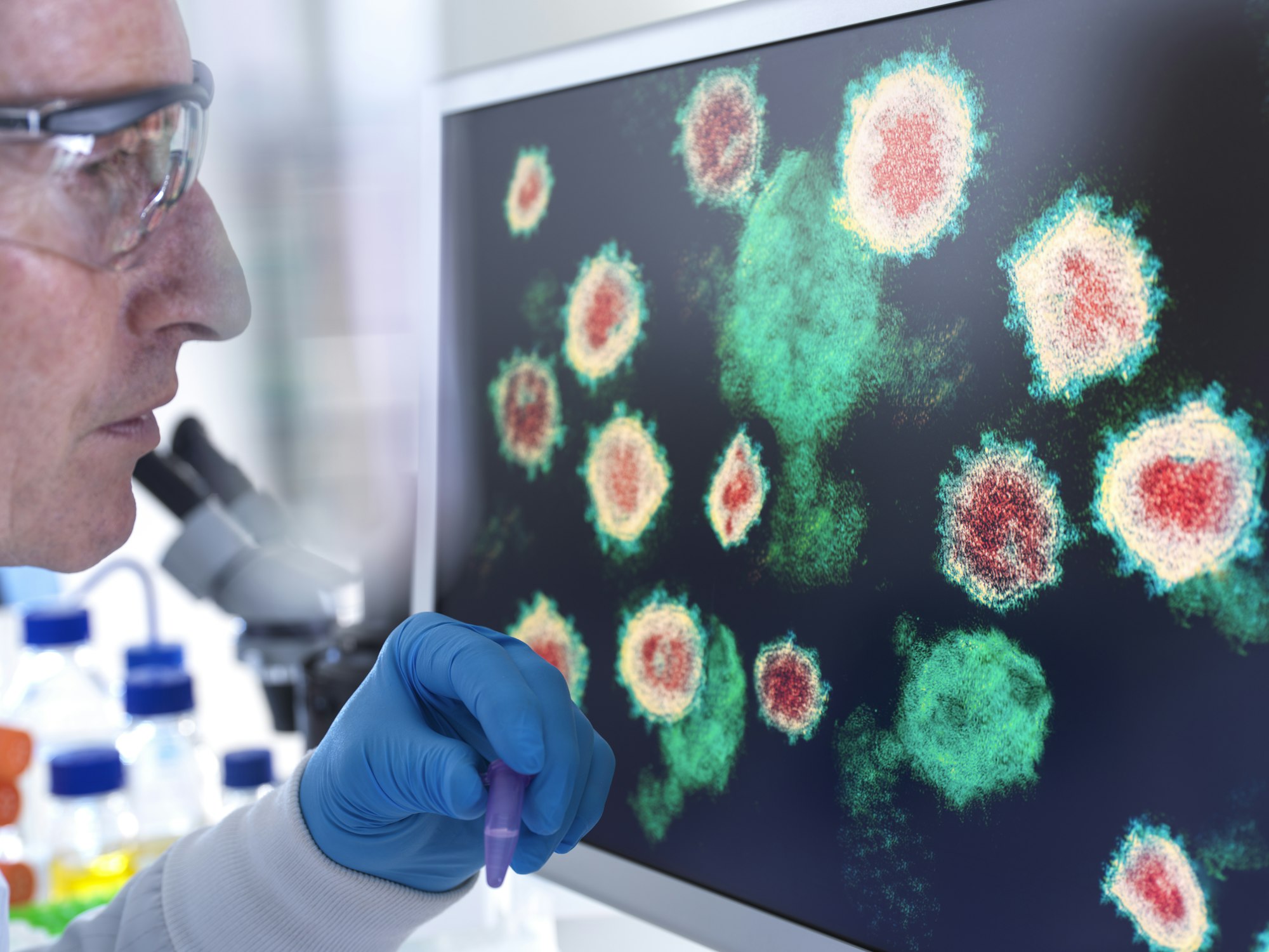 Scientist analyzing virus structures on a screen in the lab