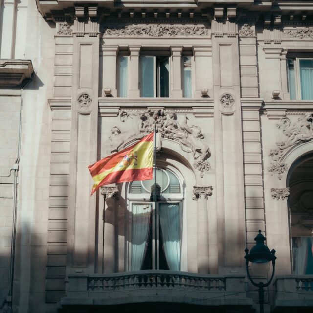 a large building with a flag on top of it